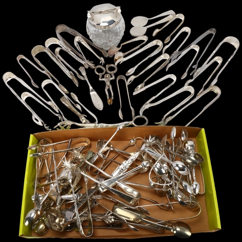 1707 - WITHDRAWN - A large quantity of silver plated sugar tongs and flatware, including novelty jester exa... 