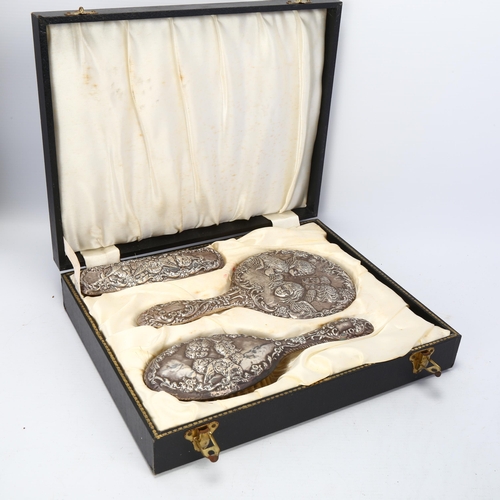 1733 - A cased Elizabeth II silver 3-piece dressing table set, B & Co, Birmingham 1967, comprising hand mir... 