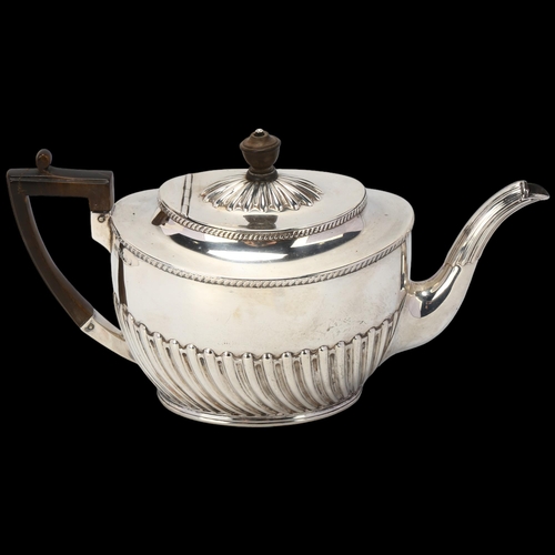 1745 - A late Victorian silver teapot, Harrison Brothers & Howson, Sheffield 1891, oval form with relief em... 