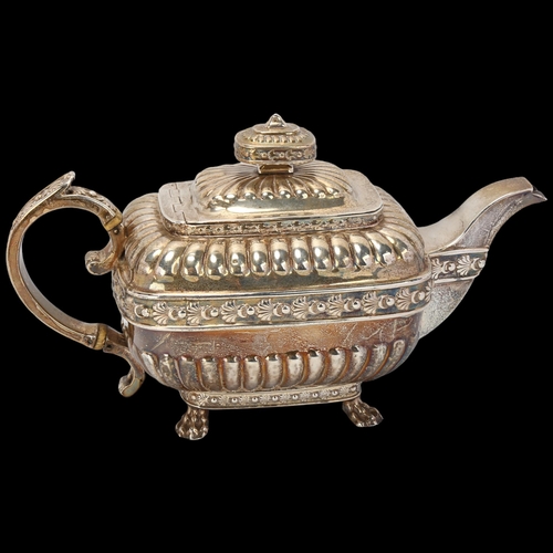 1746 - A George III silver teapot, indistinct maker, London 1812, bulbous rectangular form, with relief emb... 