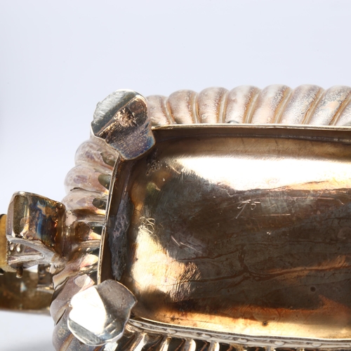 1746 - A George III silver teapot, indistinct maker, London 1812, bulbous rectangular form, with relief emb... 