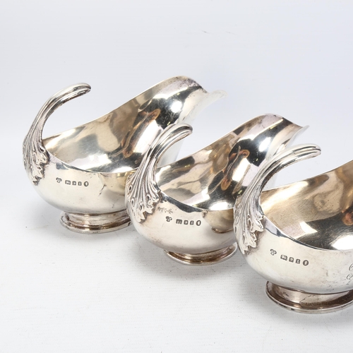 1748 - HARRODS - a graduated set of 3 George V silver sauce boats, London 1934, stylised form with floating... 