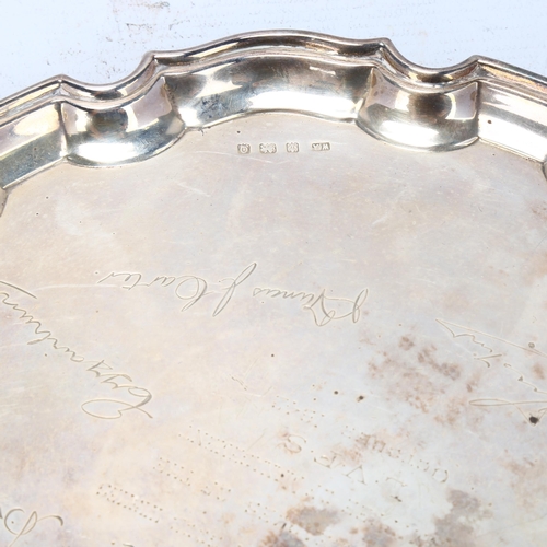 1753 - A George VI silver salver, William Adams, Birmingham 1940, circular scalloped form, raised on 3 feet... 