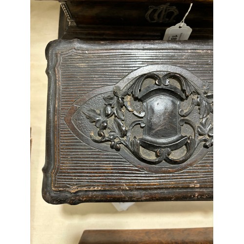 376 - A 19th century Black Forest lady's travelling box, relief carved wood, the interior fully fitted wit... 