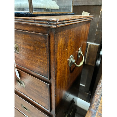 133 - An unusually small 19th century mahogany military chest of 4 long drawers in 2 parts, with recessed ... 