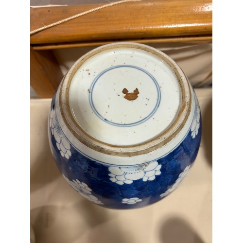 250 - A Chinese blue and white porcelain ginger jar, with blossom decoration, carved and pierced hardwood ... 