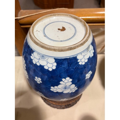 250 - A Chinese blue and white porcelain ginger jar, with blossom decoration, carved and pierced hardwood ... 