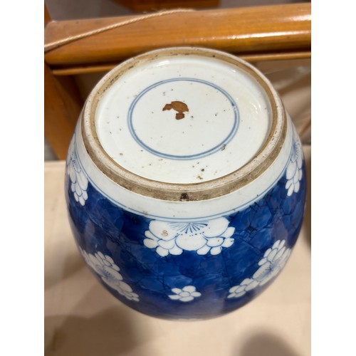 250 - A Chinese blue and white porcelain ginger jar, with blossom decoration, carved and pierced hardwood ... 