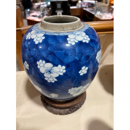 250 - A Chinese blue and white porcelain ginger jar, with blossom decoration, carved and pierced hardwood ... 