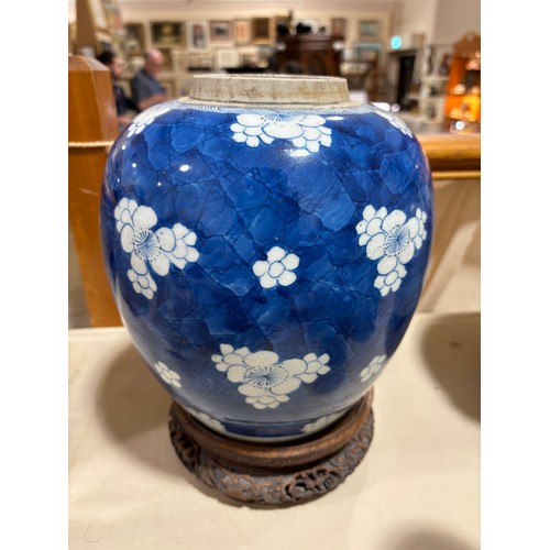 250 - A Chinese blue and white porcelain ginger jar, with blossom decoration, carved and pierced hardwood ... 