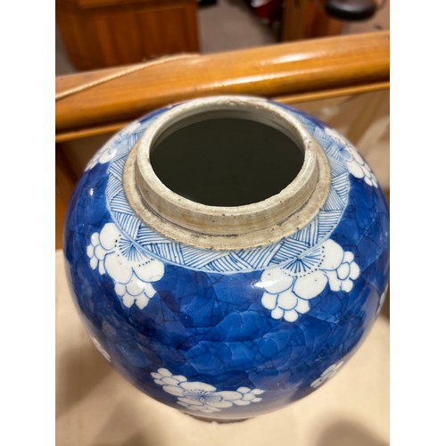 250 - A Chinese blue and white porcelain ginger jar, with blossom decoration, carved and pierced hardwood ... 