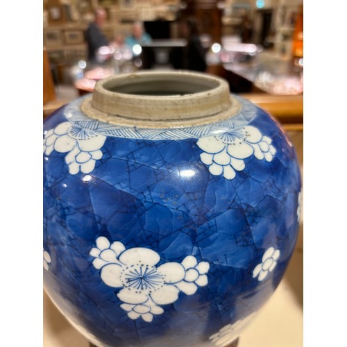 250 - A Chinese blue and white porcelain ginger jar, with blossom decoration, carved and pierced hardwood ... 