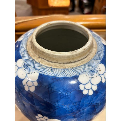 250 - A Chinese blue and white porcelain ginger jar, with blossom decoration, carved and pierced hardwood ... 