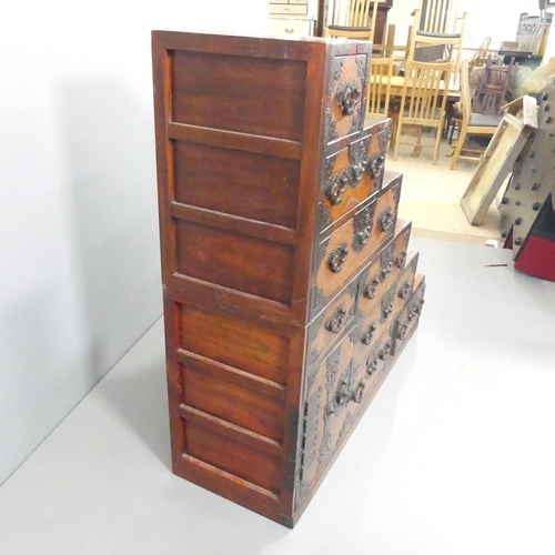 2011 - A Japanese two section Kaiden Tansu step chest of eight drawers with single cupboard. 127x120.5x40cm... 