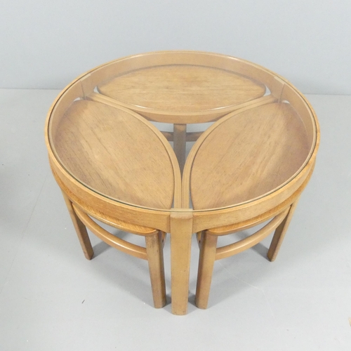 2015 - NATHAN FURNITURE - A mid-century teak circular glass-top Trinity coffee table with three oval nestin... 