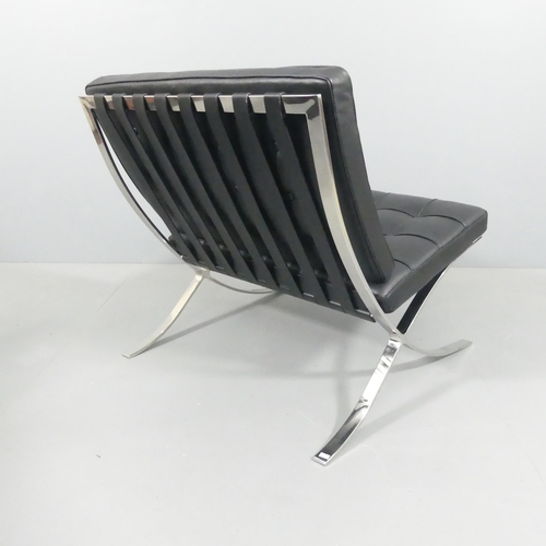 2017 - A black leather Barcelona lounge chair in the manner of Mies Van der Rohe. Overall 77x80x76cm, seat ... 