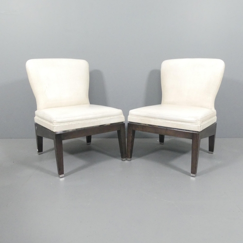 2025 - A pair of high end contemporary design slipper chairs in patterned leather with chrome detailing, wi... 