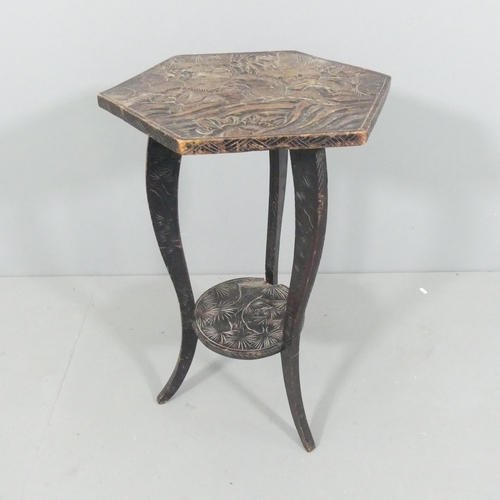 2028 - A Japanese Art Nouveau two-tier carved wood side table for Liberty & Co. circa 1900, with three wise... 