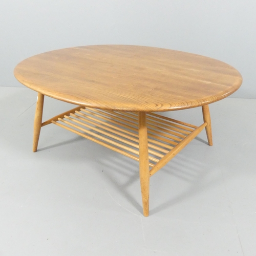 2031 - ERCOL - an elm model 454 oval two-tier coffee table. 100x44x83cm