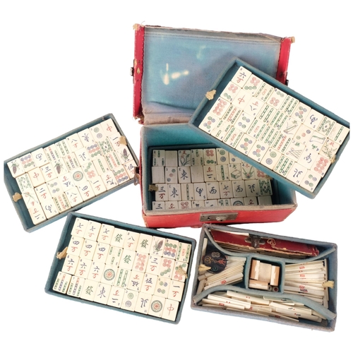 132 - A 20th century Chinese bone and bamboo Mahjong set, complete with collection of bone sticks etc, in ... 