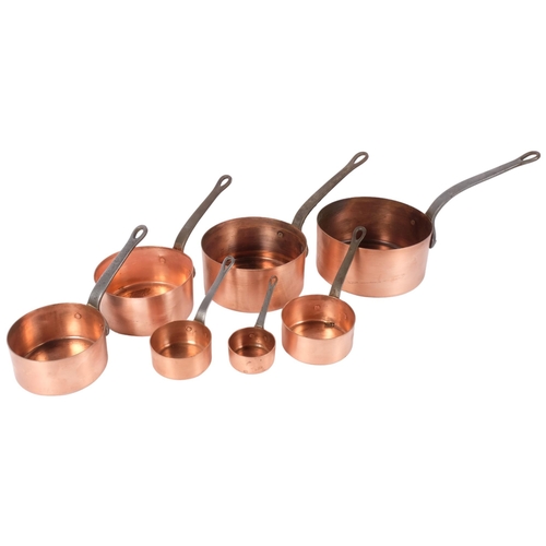 134 - A graduated set of 7 French copper saucepans with iron handles