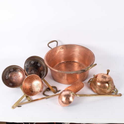 135 - A French copper 2-handled pan, a skillet, a long-handled ladle, a graduated set of sieves etc