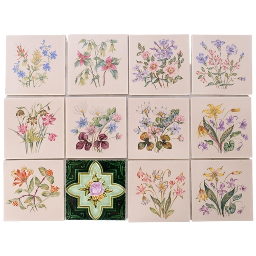 141 - A box of 11 hand painted floral tiles, and 1 other