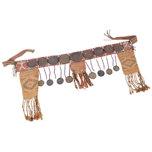 149 - An Afghan beaded and braided adornment, decorated with pressed metal discs and shells, L100cm