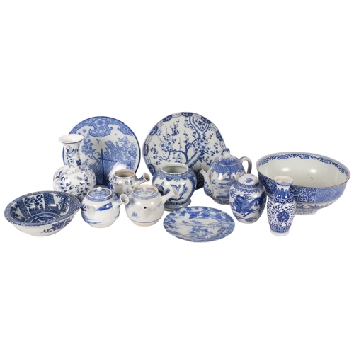 161 - A group of Oriental blue and white china, including teapots, bowls, plates etc