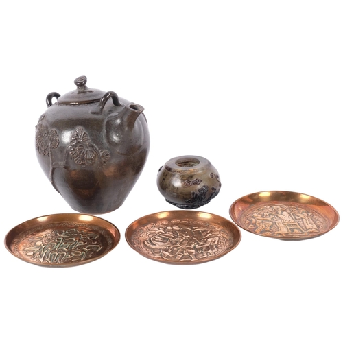 168 - A brown glazed pottery teapot, a group of 3 Middle Eastern copper embossed dishes, and a Chinese int... 