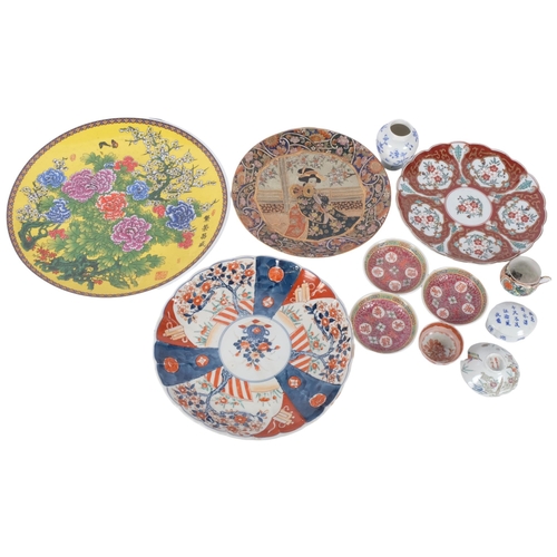 169 - A Chinese famille rose charger, diameter 36cm, an Imari plate, a tea bowl, dishes etc