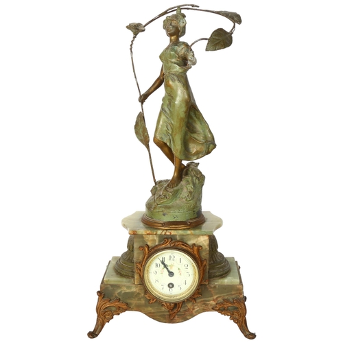 176 - An 8-day striking stepped onyx mantel clock, floral decorated dial surmounted by a patinated spelter... 