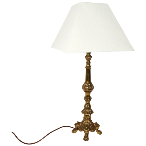 178 - A decorative embossed brass table lamp and shade, height to top of bayonet fitting 58cm