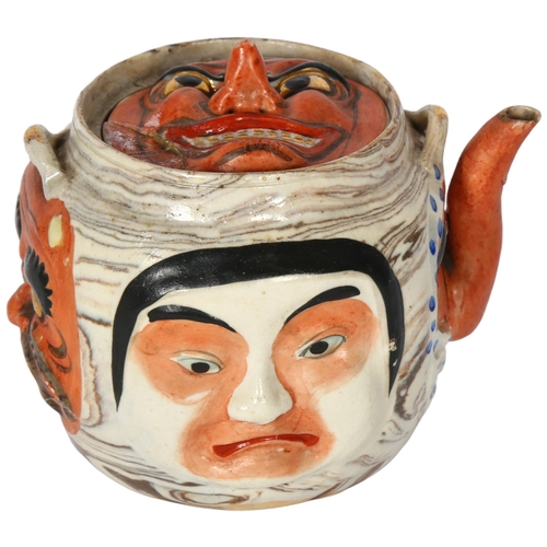 179 - A Japanese pottery hannya teapot, with woven bamboo handle, 11cm, impressed mark to the underside