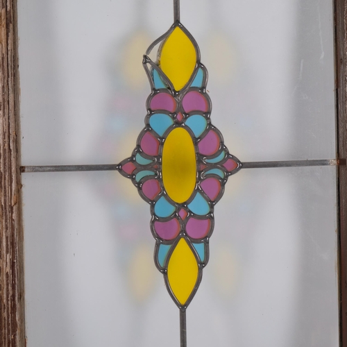 18 - A pair of coloured leadlight framed window panels, 45cm x 84cm overall, rebate size approx 33cm x 73... 