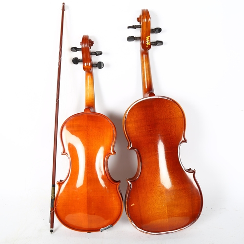 216 - A half-size violin, in hardshell case, with associated bow, label to the inside reads 