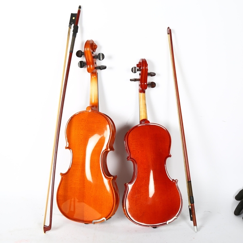 217 - A half-size violin, in associated hardshell case, with bow, label inside reads 