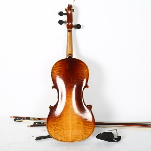 224 - A three-quarter-size violin, in hardshell case, with 2 associated bows, label reads 