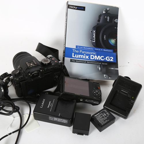 233 - A Panasonic Lumix DMC-G2 digital camera, with an associated Lumix G Vario 1:3.5-5.6/14-42mm lens, a ... 