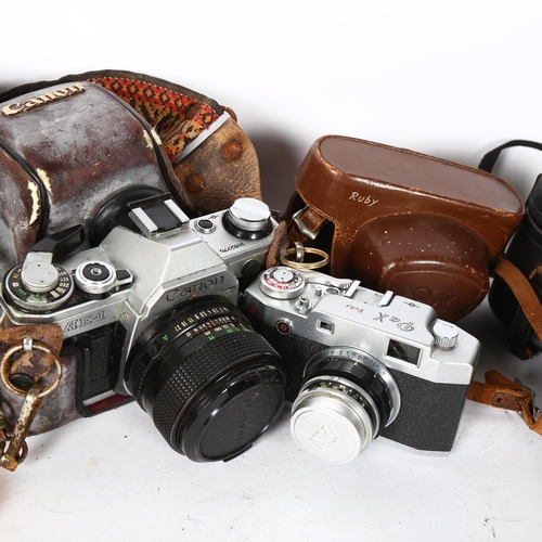 264 - A quantity of Vintage cameras and equipment, including a Canon AE-1, with associated Canon FD50mm, 1... 