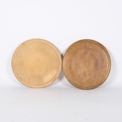 29 - 2 x 20th century circular bread boards, with carved decoration, diameter 30cm each