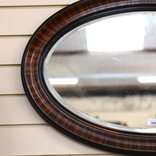 308 - A large oval mahogany-framed mirror, bevelled glass, approx 53cm x 80cm