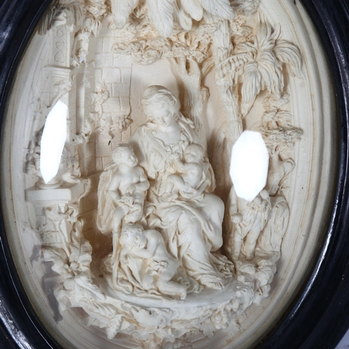 323 - A Victorian 3-dimensional plaster relief, in oval convex frame, scene depicting a female figure with... 