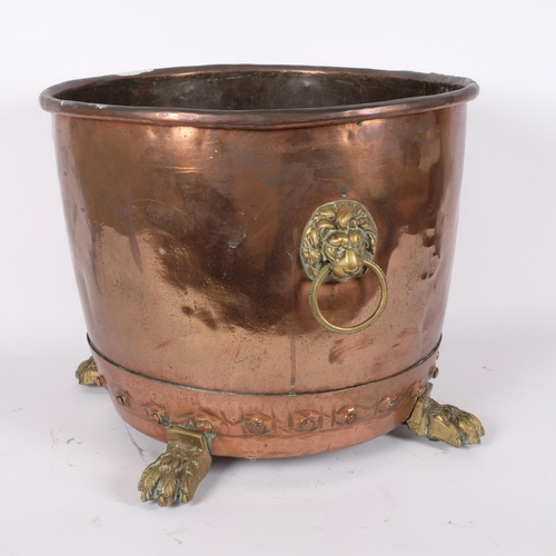 38 - A Victorian studded coal bucket, with lion mask brass ring handles and paw feet, diameter 37cm, heig... 
