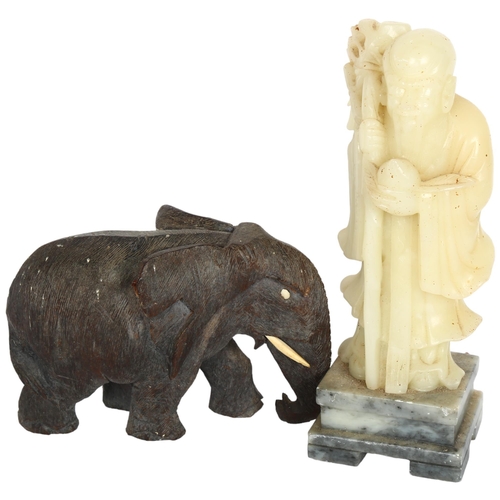 396 - An Oriental carved stone Buddha on plinth, 24cm, and a hardwood elephant