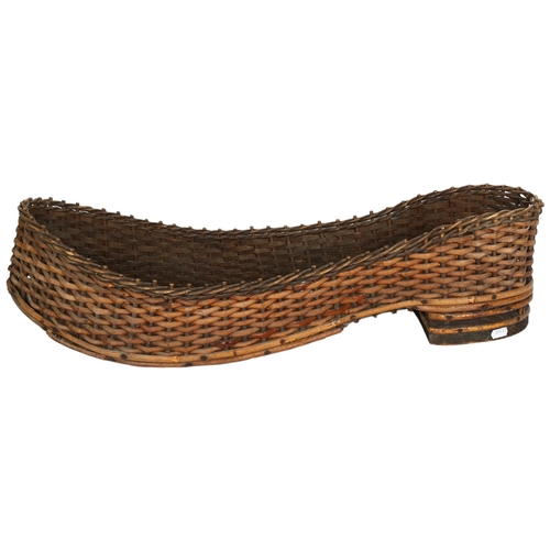 401 - An unusual shoe shape wicker basket, L70cm