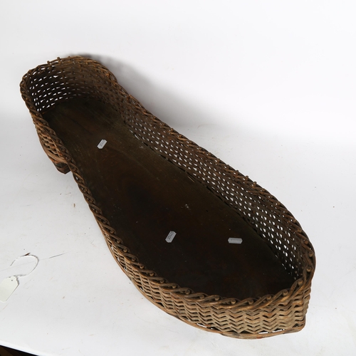 401 - An unusual shoe shape wicker basket, L70cm