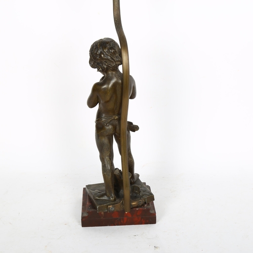 409 - A bronze figure of a boy playing the flute, signed Jean Louis Gregoire, converted to a table lamp, h... 