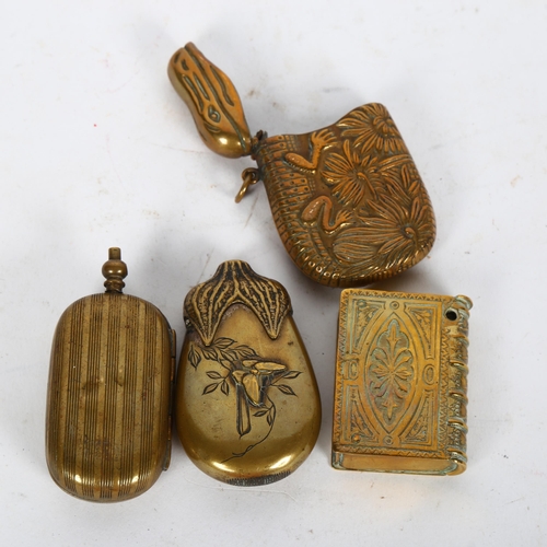 444 - An Oriental design brass Vesta, another in the form of a crocodile, a brass double sovereign holder,... 