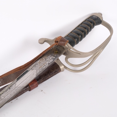 45 - An 1821 pattern Light Cavalry Officer's sword, in leather scabbard, with engraved blade, overall len... 
